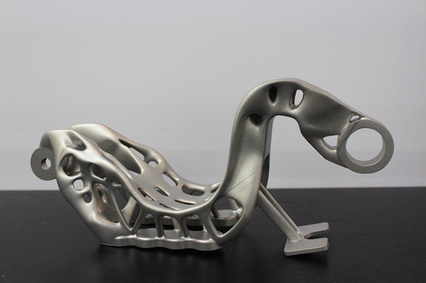 What are the key differences between SLM and DMLS in metal 3D printing