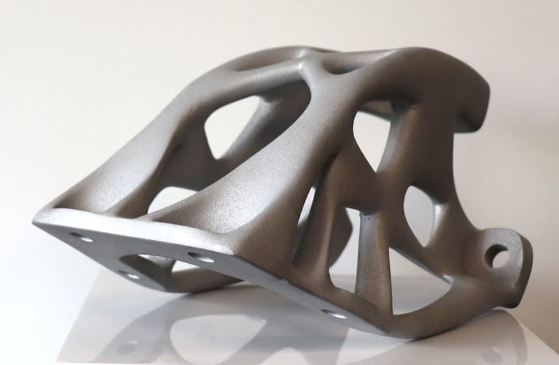 What are the key differences between SLM and DMLS in metal 3D printing